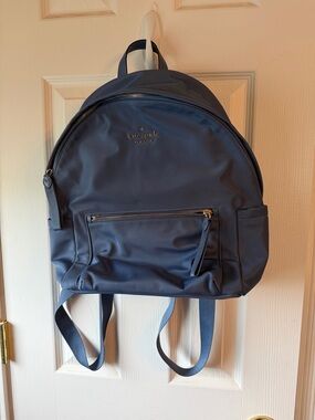 kate spade light blue backpack with gold logo. Used once . No tags